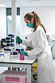 Researcher pipetting in a laboratory