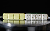 Counterfeit and authentic Xanax pills
