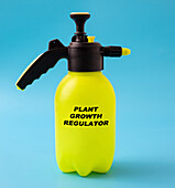 Plant growth regulator in a plastic spray, conceptual image