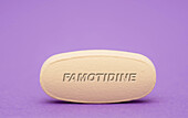 Famotidine pill, conceptual image