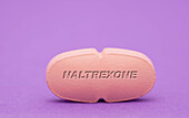 Naltrexone pill, conceptual image