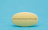 Pancrelipase amylase pill, conceptual image