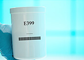 Container of the food additive E399