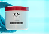 Container of the food additive E326