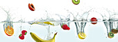 Various fruits splashing in water