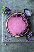 Wild violet pie with berry garnish