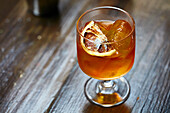 Blood orange cocktail with gin and ice cubes