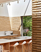 A light-flooded kitchen with an island