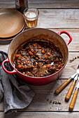 Ox cheeks with vegetables, herbs and red wine (slow cooking)