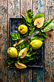 Fresh quinces with leaves