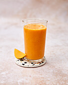 Papaya-carrot smoothie with grapefruit, date and ginger