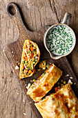 Vegetable strudel with cheese and chives sauce