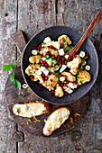 Cauliflower and pear salad with hazelnuts and pomegranate seeds