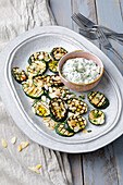 Grilled courgettes with almonds and honey feta cheese