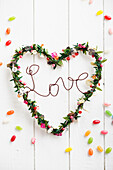Heart shaped wreath with 'Love' lettering