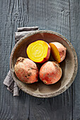Fresh golden beets in a rustic bowl