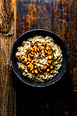 Oat root risotto with black garlic and walnut brittle