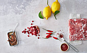 Organic lemon, frozen mince, pomegranate seeds, anchovy fillets, chilli