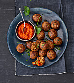 Vegan nut and chestnut balls with smoked pepper cream