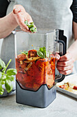 Preparing roasted tomato sauce - Pureeing tomatoes in a blender