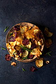 Home made vegetable crisps (potato, parsnip and beetroot) with rosemary, black pepper and sea salt
