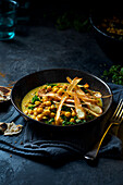 Vegan chickpea dahl with kale and roasted parsnips
