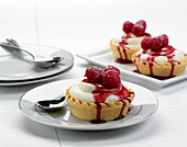 White chocolate mousse tartlets with raspberries