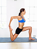 Yogaübung: Kniende Quad-Stretch
