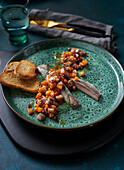 Herring and pumpkin salad with dill and toasted bread
