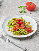 Green ribbon noodles with roast tomato sauce