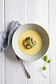 Cream of curry soup with salmon tartare