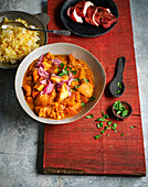 Indian potato curry with marinated chicken and paneer