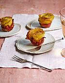 Crispy potato roses wrapped in bacon