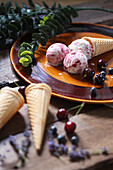 Cardamom ice cream with poppy seeds and berry swirl