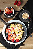 Kaiserschmarrn with fresh berries and almond slivers