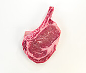 Raw rib eye steak