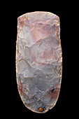 Neolithic ax cut in pink jasper