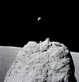 View of a boulder on the Moon and Earth, Apollo 17 image