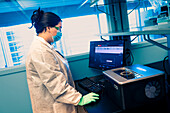 Scientist preparing a sequencing instrument