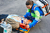Paramedics treating patient