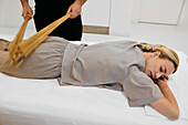 Massage therapy with bamboo sticks
