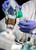 Nurse preparing oxygen mask in hospital