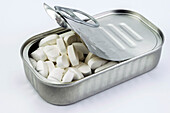 Tin metal containing white pills