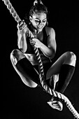 Woman rope climbing