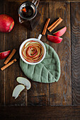 Apple rose with cinnamon in a tea cup