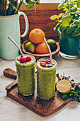 Green smoothies garnished with berries