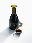 Aceto balsamico in a bottle and a small bowl