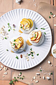 Meringue nests with peach, thyme, and almonds