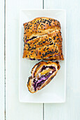 Puff pastry with red cabbage and apple filling and sesame seeds