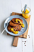 Chocolate pancakes with mango sauce